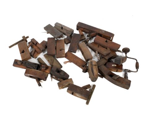 A collection of assorted vintage carpenter's wooden hand tools. Including mostly planes, marking gauge and chisel, etc. 