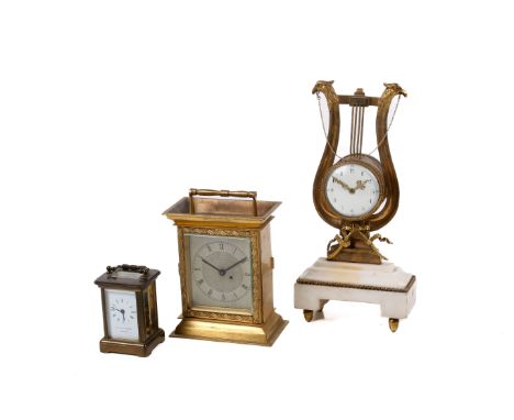 A group of three assorted timepieces. Including a Matthew Norman miniature carriage clock, a brass cased with quartz movement