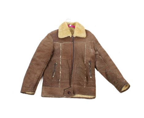 A vintage 1970s men's' sheepskin three quarter length coat. With two outside zip pockets and button waist band. Collar to hem