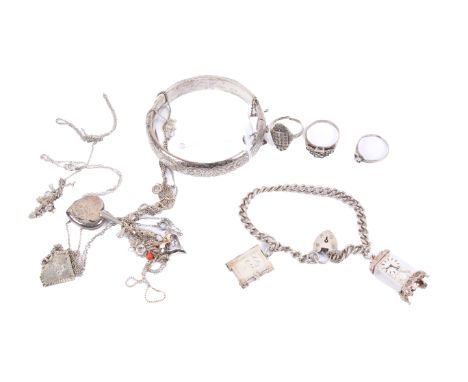 A small collection of assorted silver jewellery. Including a charm bracelet with two charms and padlock, hollow bangle with e