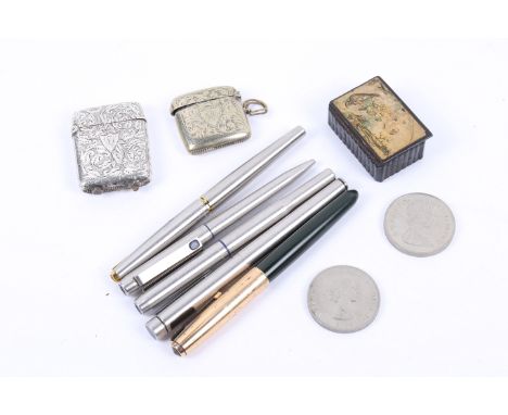 An assortment of collectables. Comprising Parker and Sheaffer pens, two coins, a lacquer snuff box, a silver lighter and a si