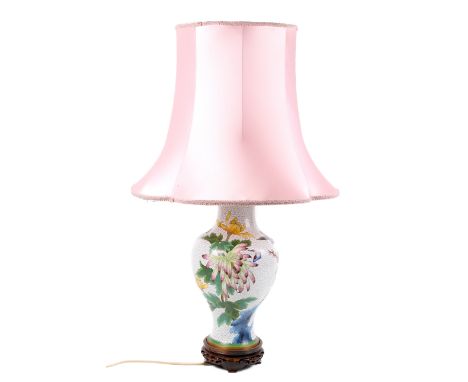 A Chinese style modern cloisonne table lamp and shade. Of baluster form decorated with prunus and other flora raised on a car