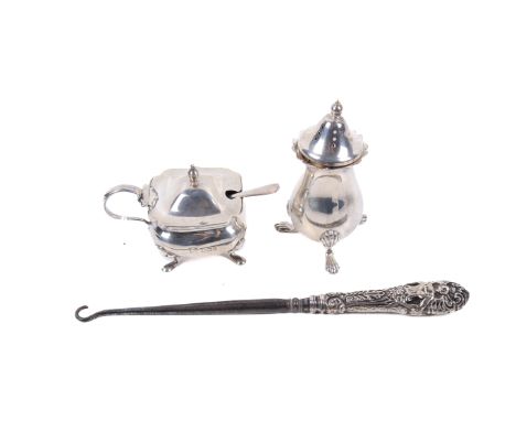 An assortment of silver. Comprising a salt shaker, maker B P Co, London 1975, H8cm, 46.9g, a condiment pot and spoon, the pot