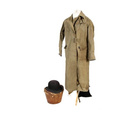 A vintage 'Bell Clothing' full length motorcycle coat and a bowler hat in original leather case.  Condition Report: Coat L122