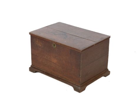 A small 19th century oak trunk chest. With a hinged lid and raised on bracket feet. H42cm x W63cm x D43cm