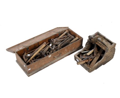 A collection of assorted vintage blacksmith / farrier hand tools. In two wooden boxes mostly hammers. 