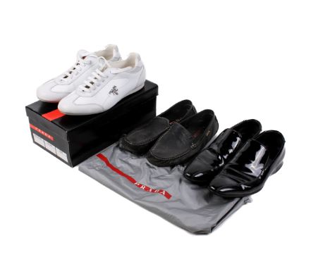 Three pairs of Prada gentlemen's shoes. Comprising a pair of  black patent leather loafers with black soles, lined in black l