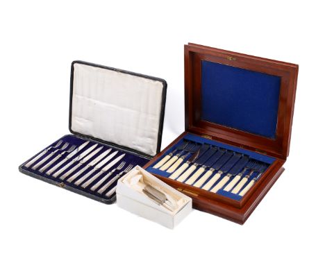 An assortment of silver-plated flatware. Including a set of butter knives with mother-of-pearl handles, and two six-piece can