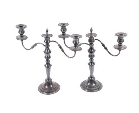 A pair of 20th century silver-plated two branch candelabra. Mounted on circular bases, H41cm