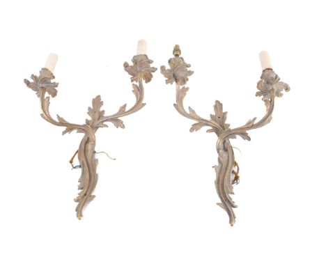 A pair of French circa 1920s gilt brass Rococo style wall candelabra. Asymmetrical with two branches. H42cm