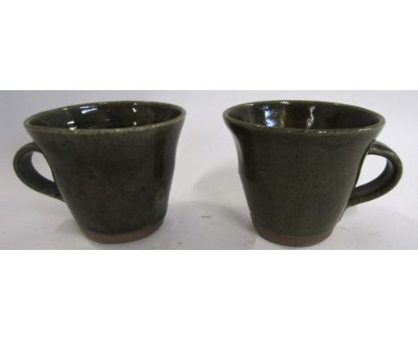 Danny Killick (b 1945) Pair of Studio Pottery cups, the ridged body with a green glazed design , 8cm high (2)