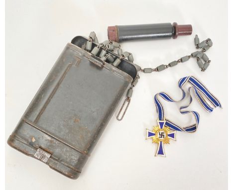 German Third Reich Mothers Cross 1st Class.  A good clean example with blue enamel decoration and original ribbon.  Accompani