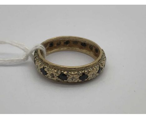 A 9ct Gold Stone Set Eternity Band, the textured centre band to reeded outer (finger size K) (2.5grams).