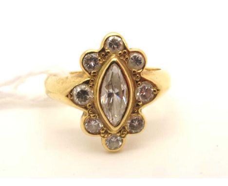 A Modern 18ct Gold Diamond Cluster Ring, of shaped design, rubover set to the centre with a marquise cut diamond, within bord