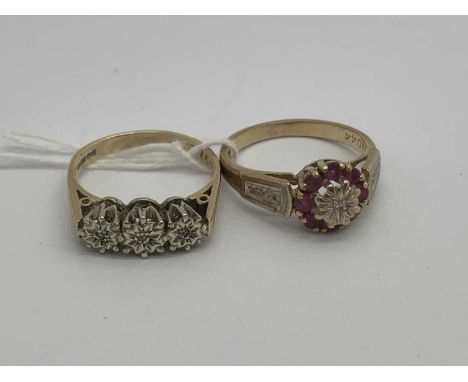A 9ct Gold Three Stone Diamond Ring, the illusion set diamonds to starburst decoration and reeded shoulders (finger size M), 