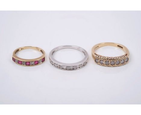 Gold (9ct) diamond seven stone eternity-style ring, a gold (9ct) diamond and ruby eternity-style ring and a white gold diamon