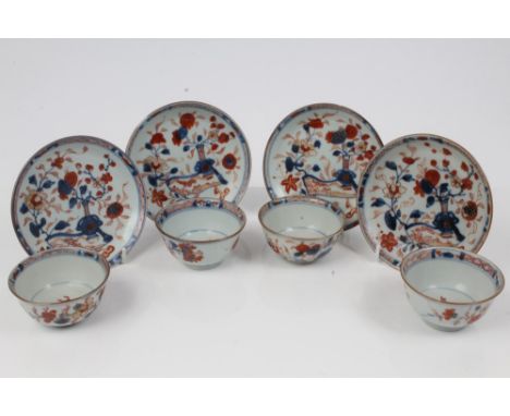 Set of four early 18th century Chinese Imari tea bowls and saucers, each decorated with moonflask issuing flowers and landsca