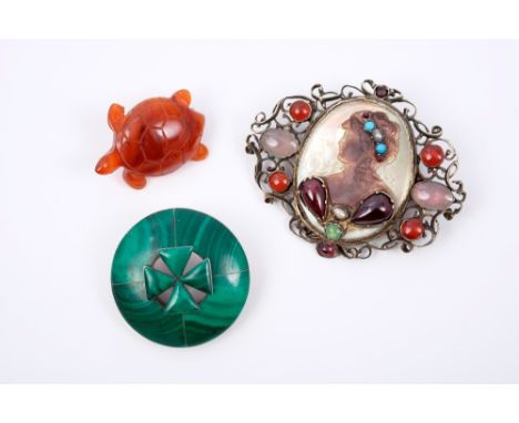 Unusual carved mother of pearl cameo brooch set with cabochon gemstones, malachite brooch and a simulated amber turtle brooch