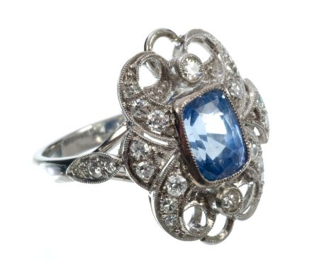 Sapphire and diamond cocktail ring with a central cushion cut cornflower blue sapphire estimated to weigh approximately 2.30 