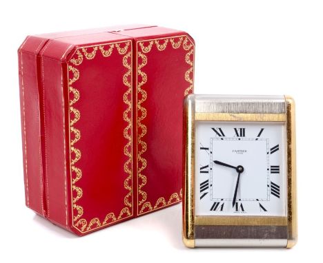 Cartier travelling alarm clock with quartz movement and white enamel dial, signed - Cartier Paris, in a rectangular bi-metal 