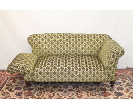 Late 19th century drop-end sofa with green velvet upholstery, on turned supports and castors