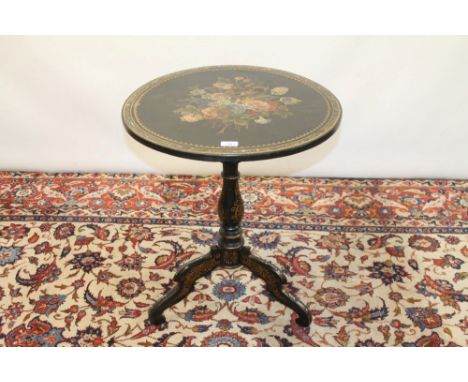Victorian ebonised papier mâché tilt-top circular table with painted and mother of pearl inlaid floral decoration, on turned 