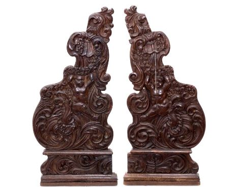 Pair of 18th century oak Baroque carved brackets, each carved in deep relief with cherub, garlands and scrolling acanthus, 11