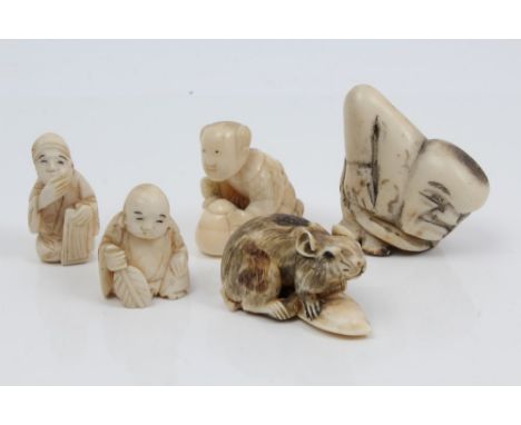 Japanese carved ivory netsuke finely modelled as a rat on a seed pod, signed to the underside, 4.5cm long, together with thre