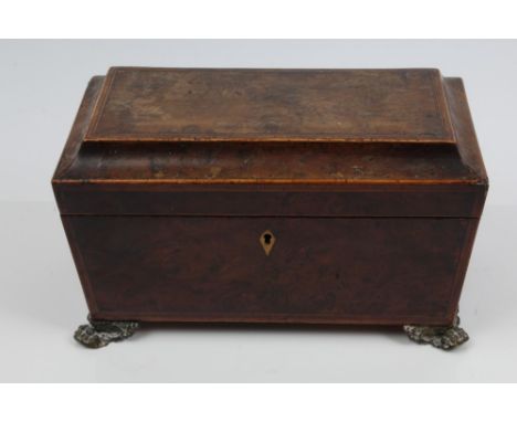 Regency burr yew and tulipwood crossbanded tea caddy of sarcophagus form, the hinged cover enclosing interior with twin recta