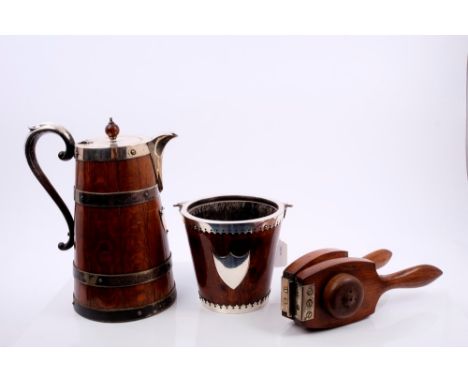 Early 20th century coopered oak lemonade jug of tapering form, with silver plated mounts, applied shield and hinged cover wit