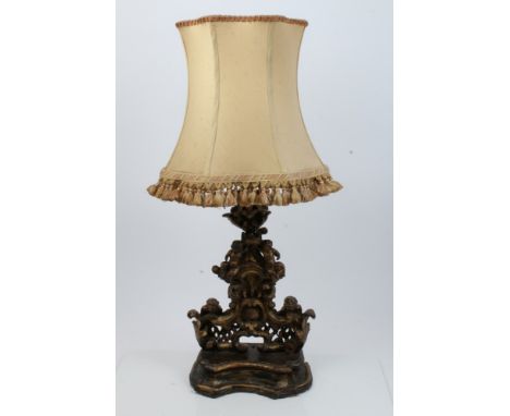 18th / 19th century Italian rococo giltwood carving now as a lamp base, heavily carved and pierced column ornamented with put