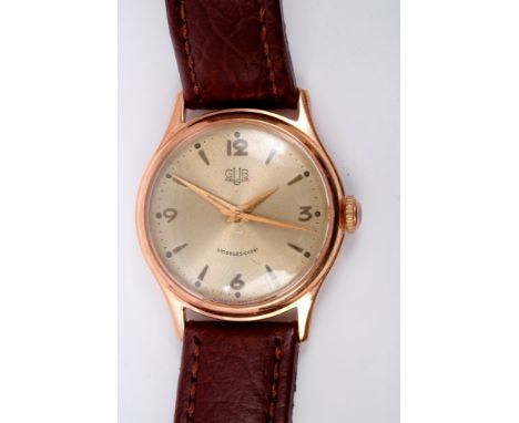 Rare 1950s East German Gub Glashutte wristwatch with engine-turned circular dial, applied Arabic and spear-head hour markers,