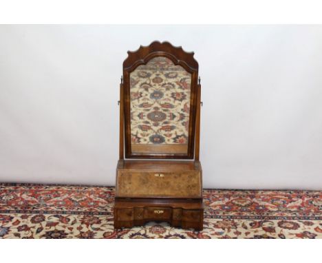 Queen Anne-style walnut crossbanded toilet mirror with shaped rectangular swing plate above sloping fall enclosing a fitted i