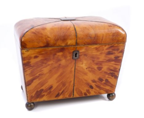 Early 19th century blonde tortoiseshell tea caddy of sarcophagus form, with domed top, interior with two lidded compartments,