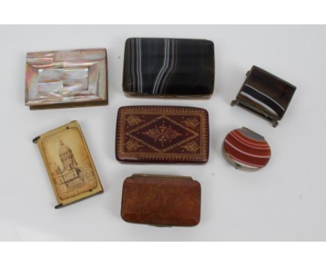 Banded agate snuff box with bevelled hinged cover, 8cm long, together with three other agate boxes and three further boxes (7