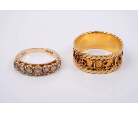 Yellow metal ring with applied emblems and a gold (9ct) seven stone ring (2)