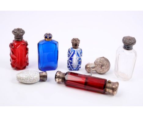 Collection of seven Victorian and later silver and white metal mounted scent bottles, including one double-ended ruby glass s