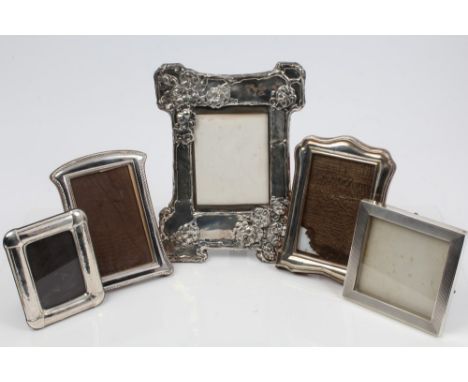 Edwardian silver photograph frame of shaped form, with embossed Art Nouveau floral decoration, RD 419352 (Birmingham 1904), G
