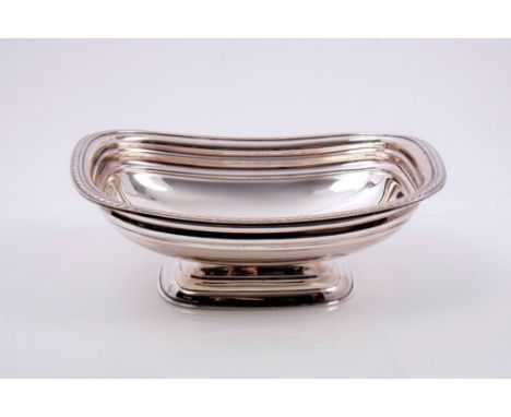 1930s silver dish of rectangular form, with bead and ropework border, on a rectangular domed and stepped base (Sheffield 1931