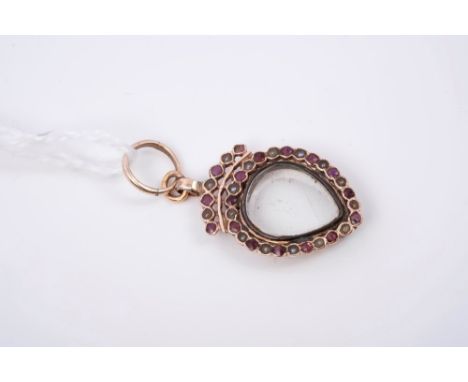 Georgian garnet and seed pearl locket with hinged glazed back and a border of garnets alternating with seed pearls and stylis