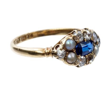 Victorian sapphire, diamond and pearl ring with a central oval mixed cut blue sapphire surrounded by six old cut diamonds and