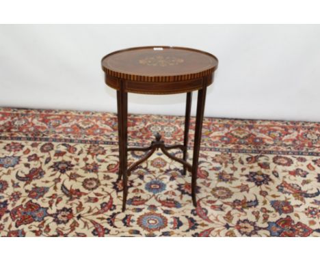 Edwardian inlaid mahogany oval occasional table, dished top centred by geometric pen-heightened inlaid device, on chequer str