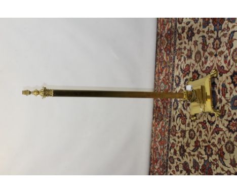 Brass Corinthian column standard lamp raised on stepped square base with claw feet, 142cm high