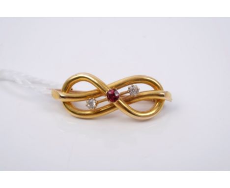 Victorian ruby and diamond knot brooch with a central mixed cut ruby and two old cut diamonds, 32mm CONDITION REPORT Very goo