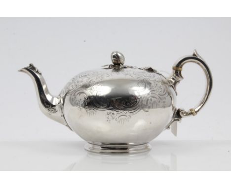 Victorian silver teapot of bullet form, with chased and engraved foliate decoration, silver loop handle with ivory insulators