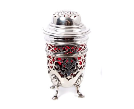 Edwardian silver sugar caster of cylindrical form, with pierced foliate decoration, ruby glass liner and detachable pierced d