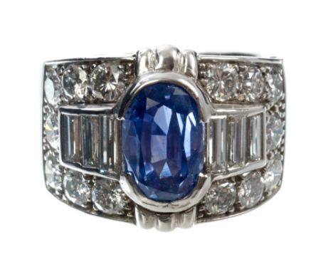 Art Deco-style sapphire and diamond cocktail ring, the wide band with an oval mixed cut Sri Lankan blue sapphire weighing 5.0