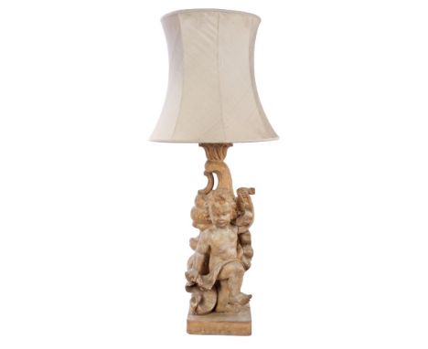 Rococo-style carved pine figural lamp base modelled as a standing putto with drapery and rising C-scroll column on square pli