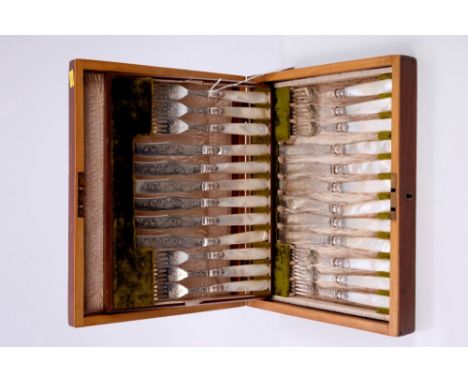 Early Edwardian twenty-four piece silver fruit set comprising twelve pairs knives and forks with engraved decoration and silv