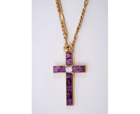 Amethyst and diamond cross pendant with central brilliant cut diamond and eleven square step cut amethysts in channel setting